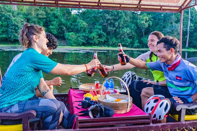 Angkor Bike & Gondola Ride at Twilight - A private dragon boat at the end of the day