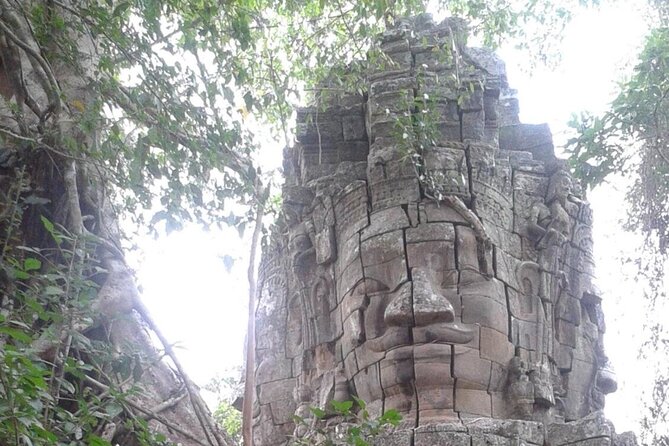 Angkor Full Day Tour All The Main Temples - Angkor Thom South Gate and the smiling faces of Bayon