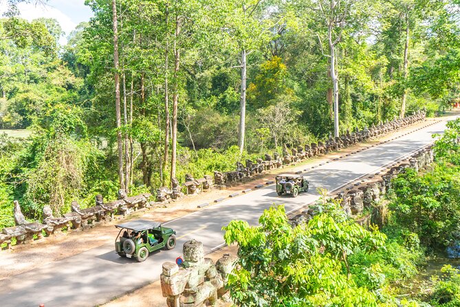 Angkor Jeep Tour Discovery - Inclusive Lunch - Ta Prohm, where trees take over the ruins