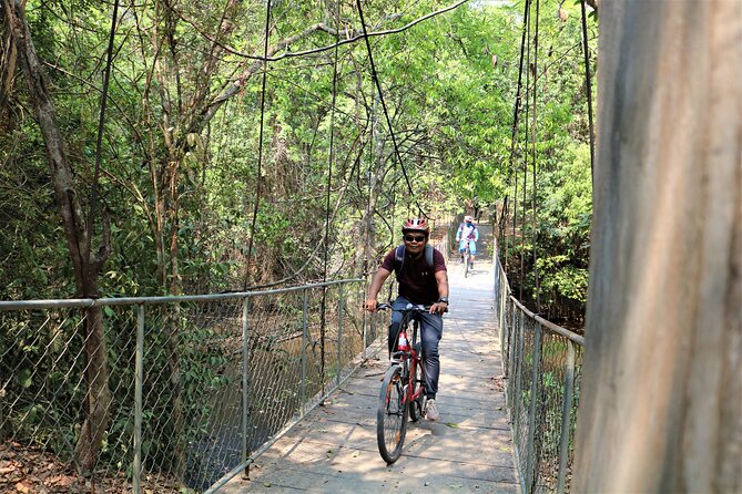 Angkor Sunrise Expedition Cycling Through Serene Backroads - Along the Angkor Thom wall