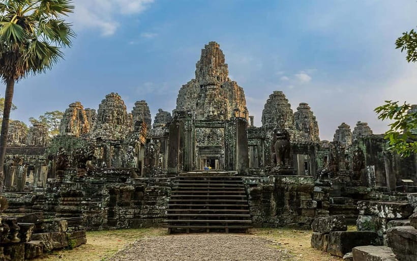 Angkor Wat: Full-Day Guided Sunset Tour - Bayon and Angkor Thom: the faces of the Khmer Empire