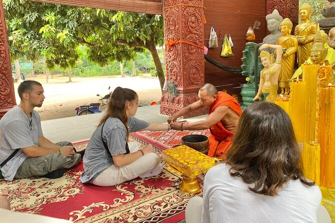 Buddhist Monastery with Monks Water Blessing - A water blessing with a real Cambodian setting