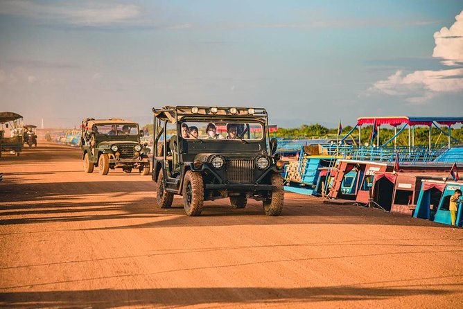 Floating Village Sunset Boat & Jeep Tour - Inclusive Drinks - Leaving Siem Reap in an open-air jeep