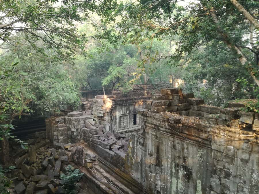 From Siem Reap: Half-Day Tour to Beng Mealea Temple - Entering a 12th-century temple reclaimed by trees
