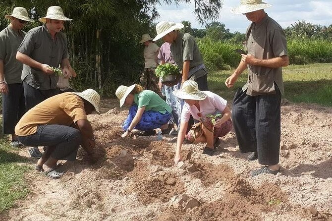 Full Day Siem Reap Farm Tour with Cooking Class and Monk Blessing - A sacred water blessing at a Buddhist monastery