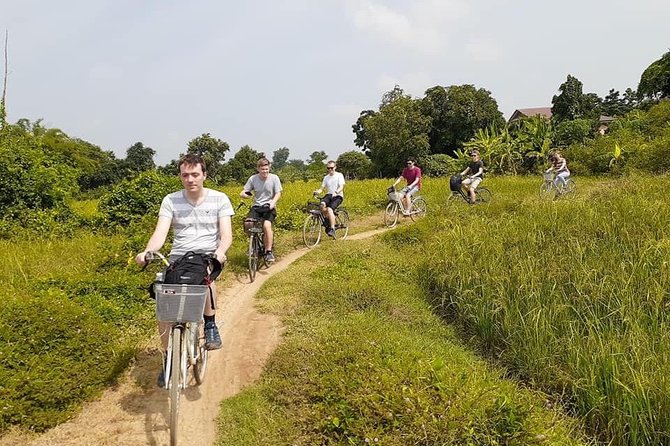 Half day morning bicycle tour to Explore local livelihood and test local snacks - Wat Samrong Knong and Cambodia’s painful past