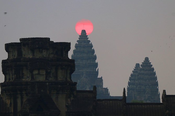 One Day tour with sunrise in car with A/C or Van & Guide. - Angkor Thom and the smiling faces of Bayon