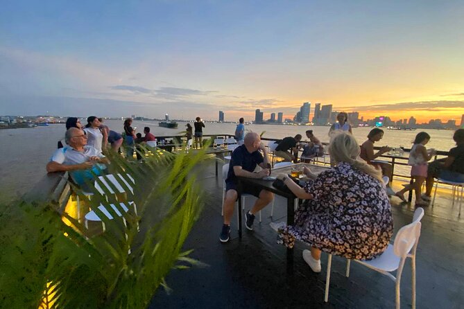 Sunset Cruise with free flow beer, soft drinks & fruit platter - A sunset view of Phnom Penh from the Tonlé Sap