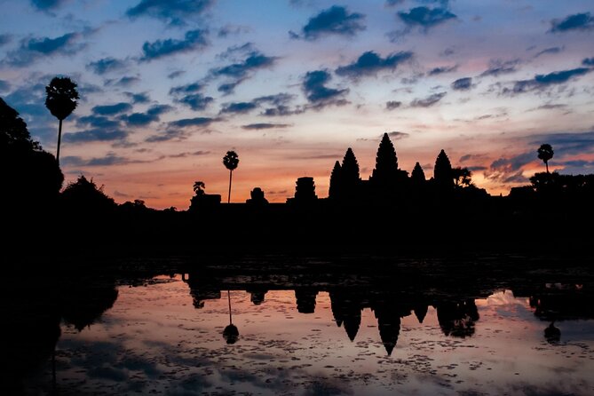 The Angkor Temples from Sunrise by Tuk Tuk - Angkor Thom and the stone faces of Bayon
