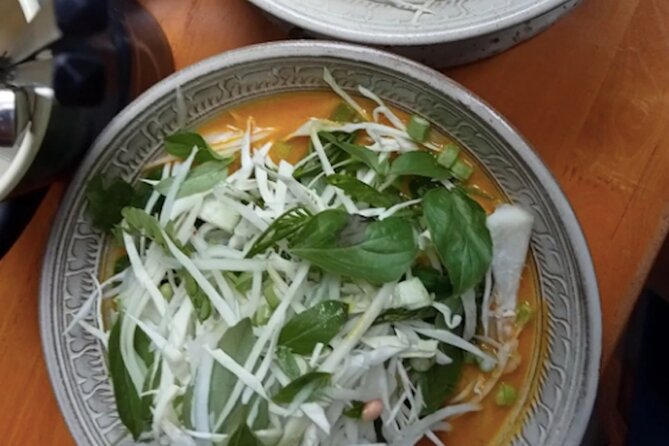 Ultimate Phnom Penh Food Tour by Tuk Tuk: 20 Tastings and Drinks - Russian Market after dark, with smoky pork ribs